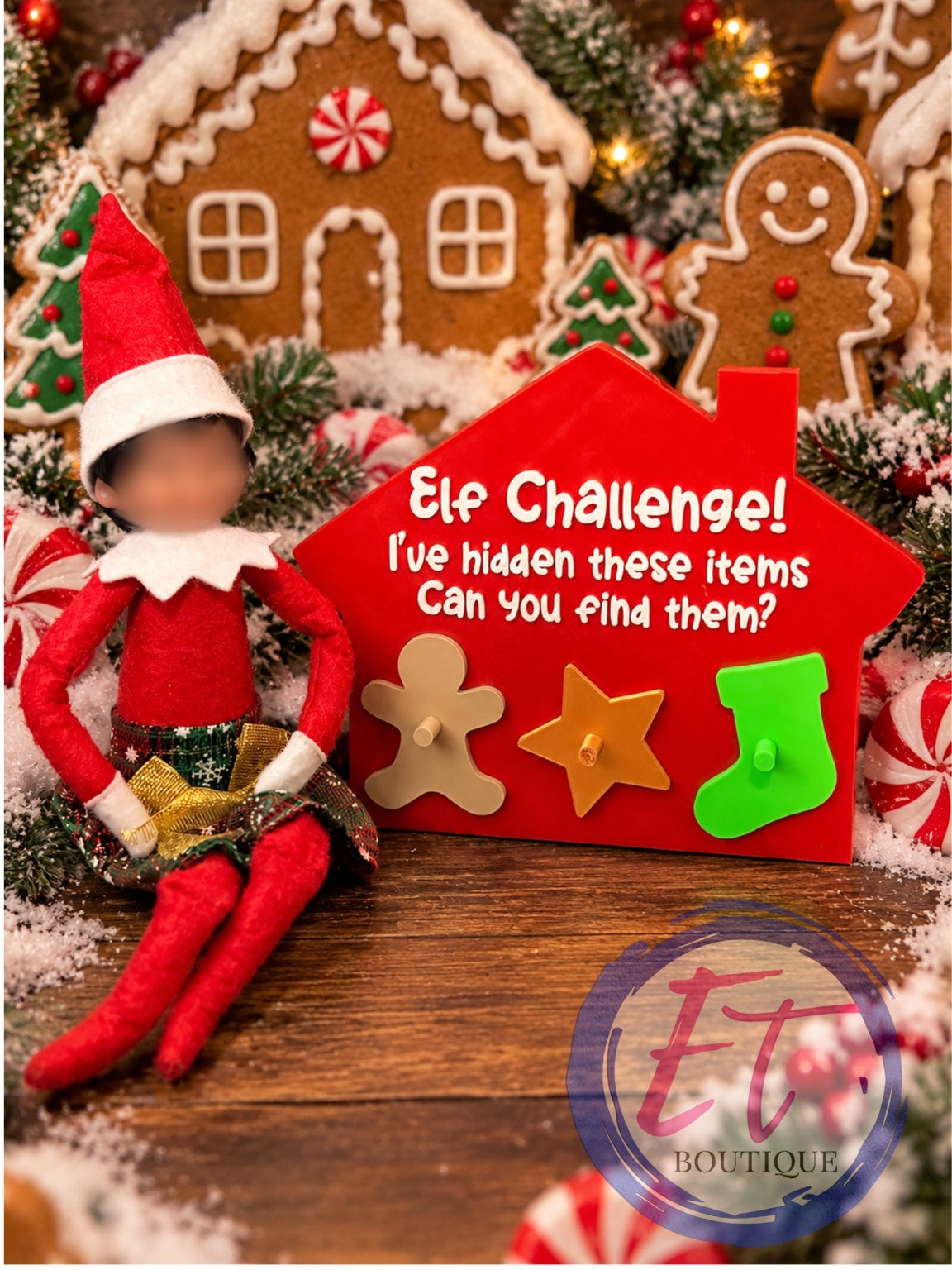 Red house-shaped Christmas Elf Challenge board with gingerbread star and stocking pieces