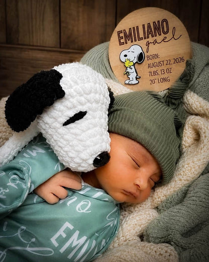 Newborn photo featuring a personalized wooden birth stats sign