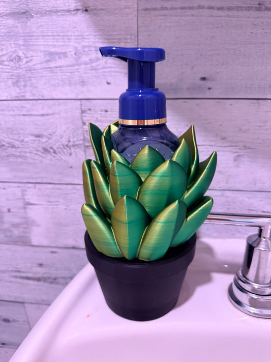Custom 3D printed succulent soap holder, green and gold leaves in a black pot, bottle shown for fit